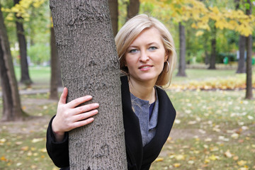 Portrait of the girl in autumn park