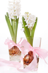Hyacinth bulbs and flowers  in a glass .