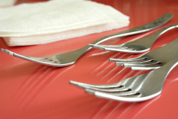 Plugs and napkins on a red background