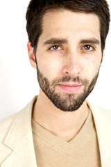 Obraz premium Attractive Young Man looking sternly at camera