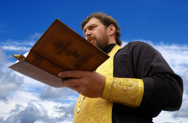 Orthodox priest reads prayer
