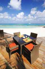 chair and table at beach of maldives