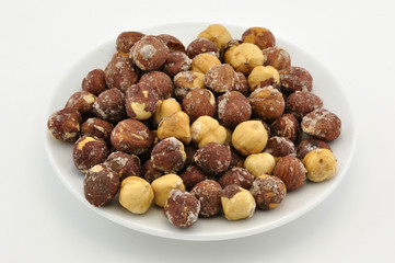 Hazelnuts appetizer on white plate