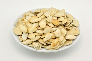 Pumpkin seeds appetizer on white plate