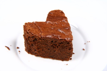 Heart shaped slice of a brownie on a plate