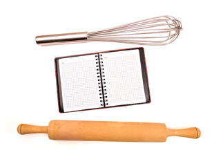 empty notepad among kitchen utensils