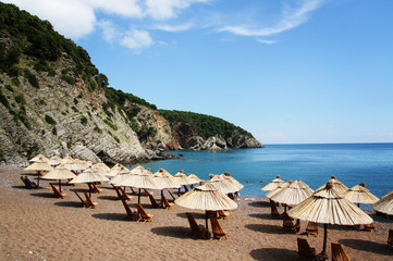 Beautiful beach with umbrellas and chairs