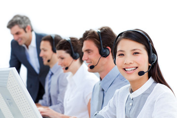 Positive business team talking on headset