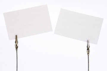 Clamps holding  blank cards