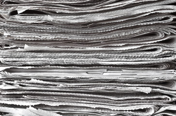 Pile of folded newspapers