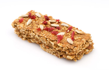 Granola bar with cranberries and nuts isolated on a white