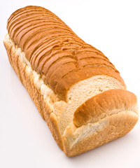 Large loaf of sliced white bread isolated on white background
