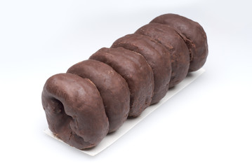 Row of chocolate glazed donuts