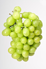 Bunch of green grapes isolated on white background
