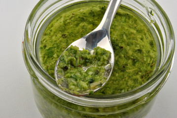 home made fresh pesto in a glass and spoon