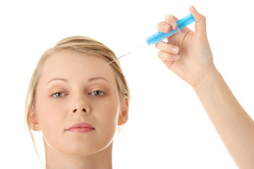 Beautiful woman receiving a botox injection