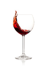 Splashing red wine in a glass
