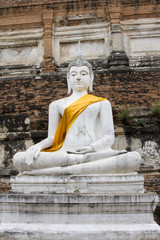 Stone statue of a Buddha in Ayutthaya, Thailand.