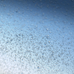 Water drops on blue, shallow DOF