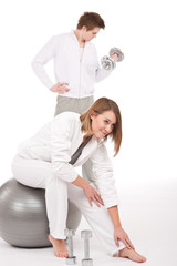 Obraz premium Fitness - Young couple training with weights and ball