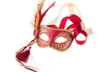red and gold feathered carnival mask isolated on a white