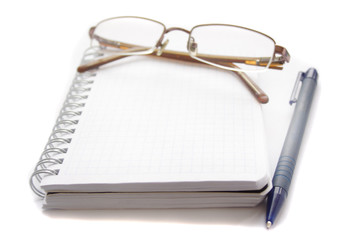 Glasses lying on a notebook