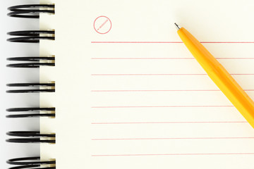 Clean sheet of notebook with orange pen