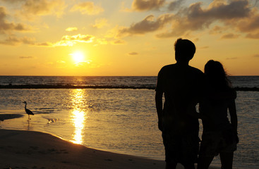 Couples figure with sunset background