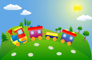 Colored toy train on the green mountain