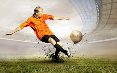 Obraz premium Shoot of football player on the field of olimpic stadium