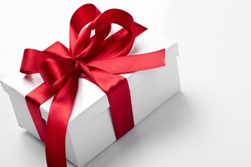 Gift decorated with a tape and a bow