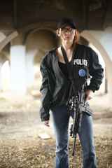 Female police officer with gun.