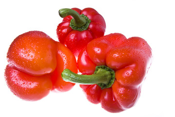 red juicy peppers on white background
