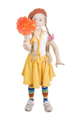 Little girl standing and holding a flower.