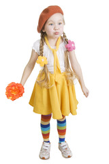 Little girl standing  holding a flower and grimacing.