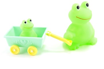 Mother pulling baby toy frog
