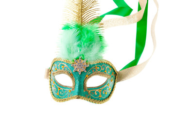 green and gold feathered carnival mask isolated on white