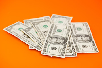 dollars on color background