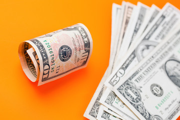 dollars on color background