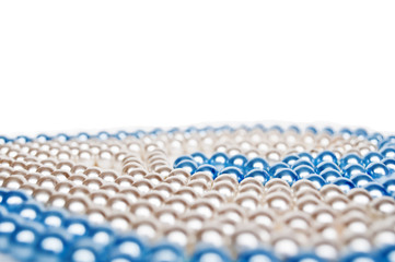 Close-up of cyan and white pearls