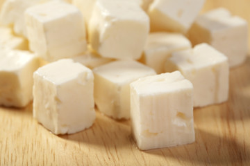 feta cheese on wooden cutting board