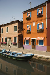 Fototapeta na wymiar Buildings and Boat on Canal in Venice