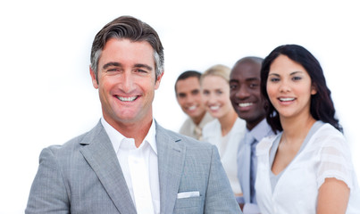 Confident mature businessman with his team