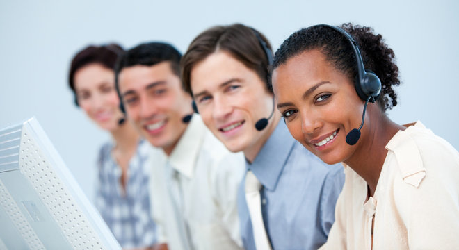 A diverse business team working in a call center