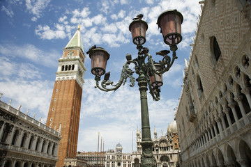 Fototapeta na wymiar Street Lamp and Bell Tower at St Mark's Basilica