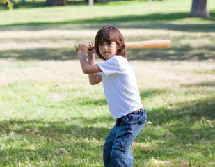 Portrait of adorable child playing baseball