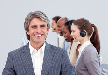 Cheerful manager in front of his team