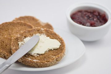 Buttered roll and cherry jam