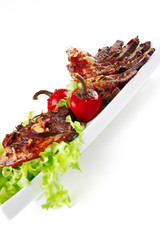 served meat on ceramic plate