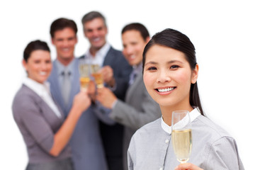 Asian businesswoman and her team celebrating a success